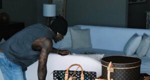 Fans react as Asake flaunts Louis Vuitton trunk worth over N90m